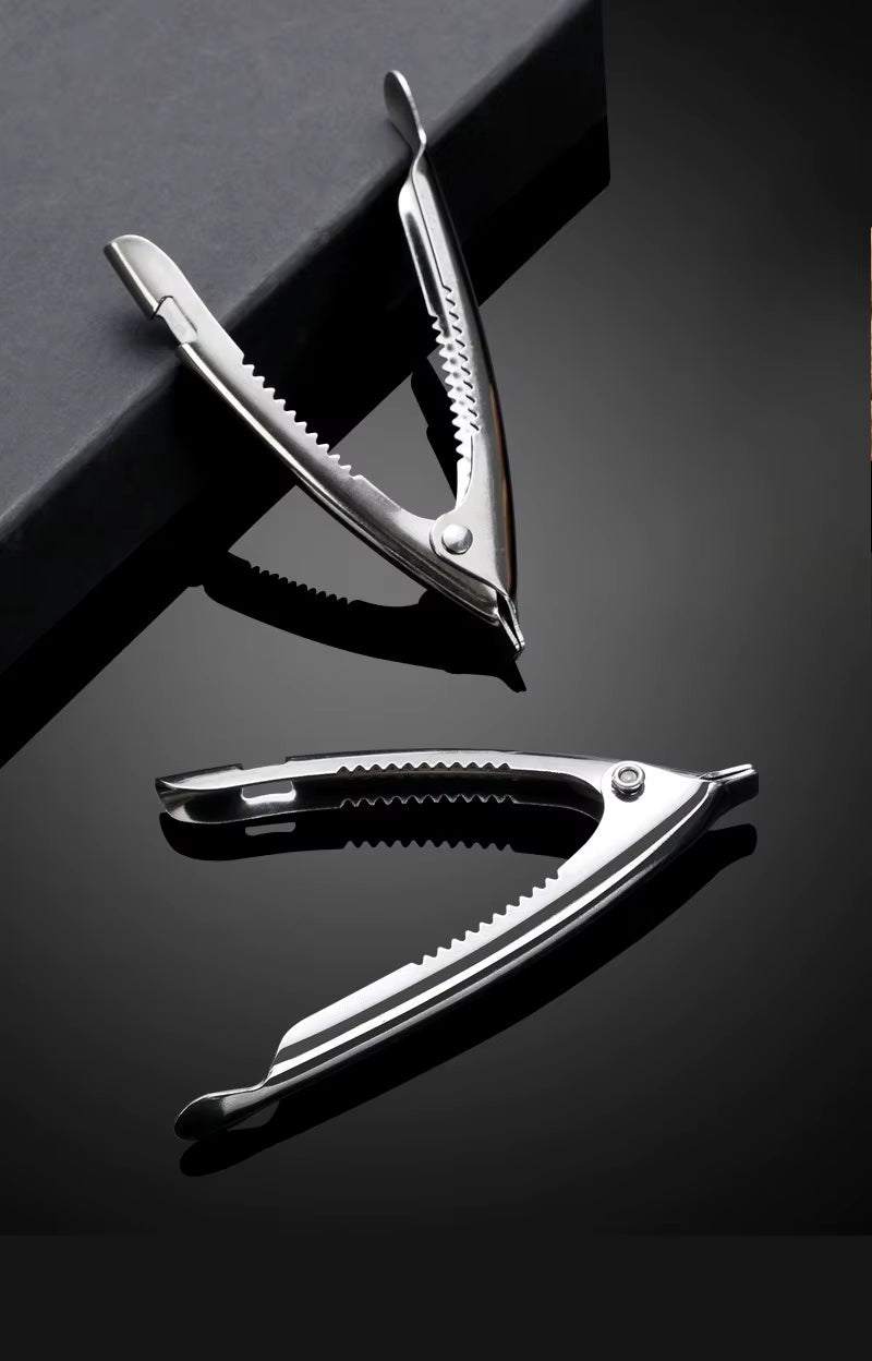 Federbelasteter Muschelöffner aus Edelstahl & Nusszange