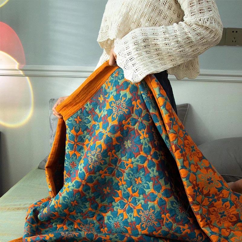 Ethniquilt - Baumwollquilt mit orange-blauem Muster in sechs Lagen